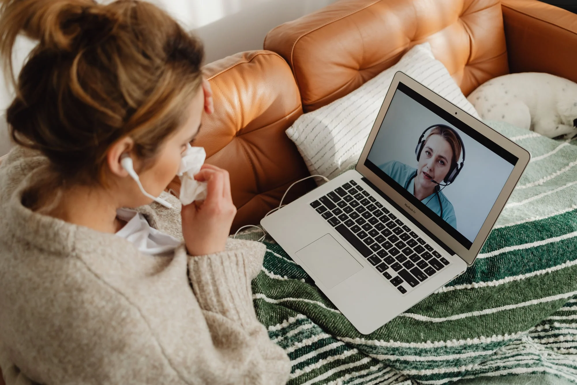 Woman talking with a provider on a video call at home.