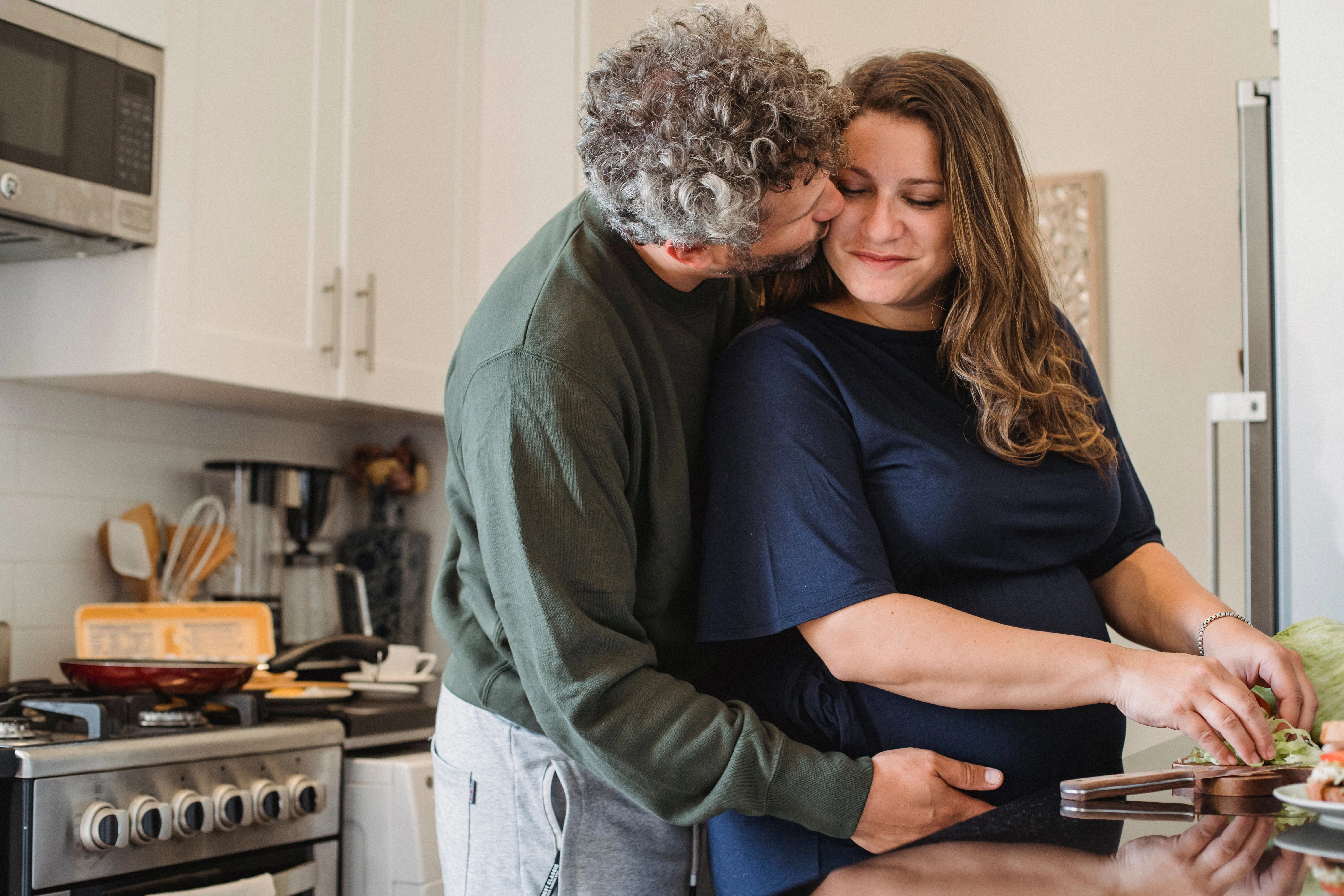 Couple cooking together in their kitchen